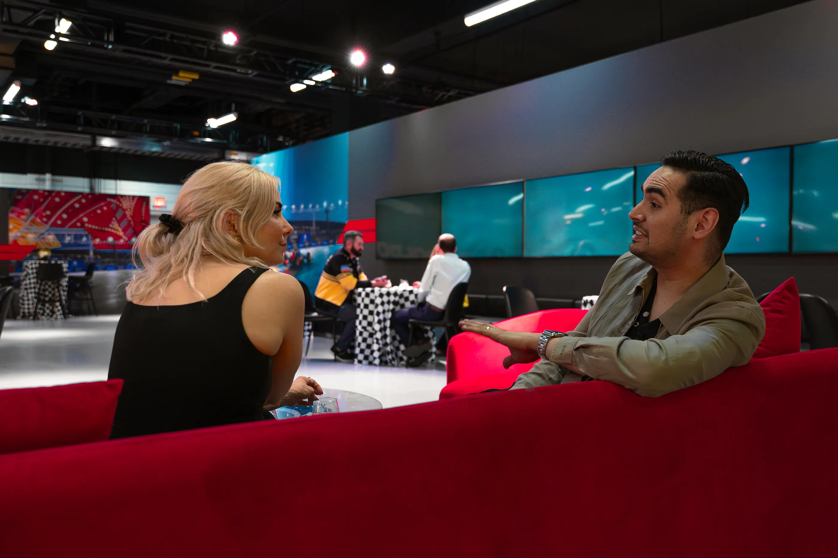 Guests speak inside an Attentive event lounge.