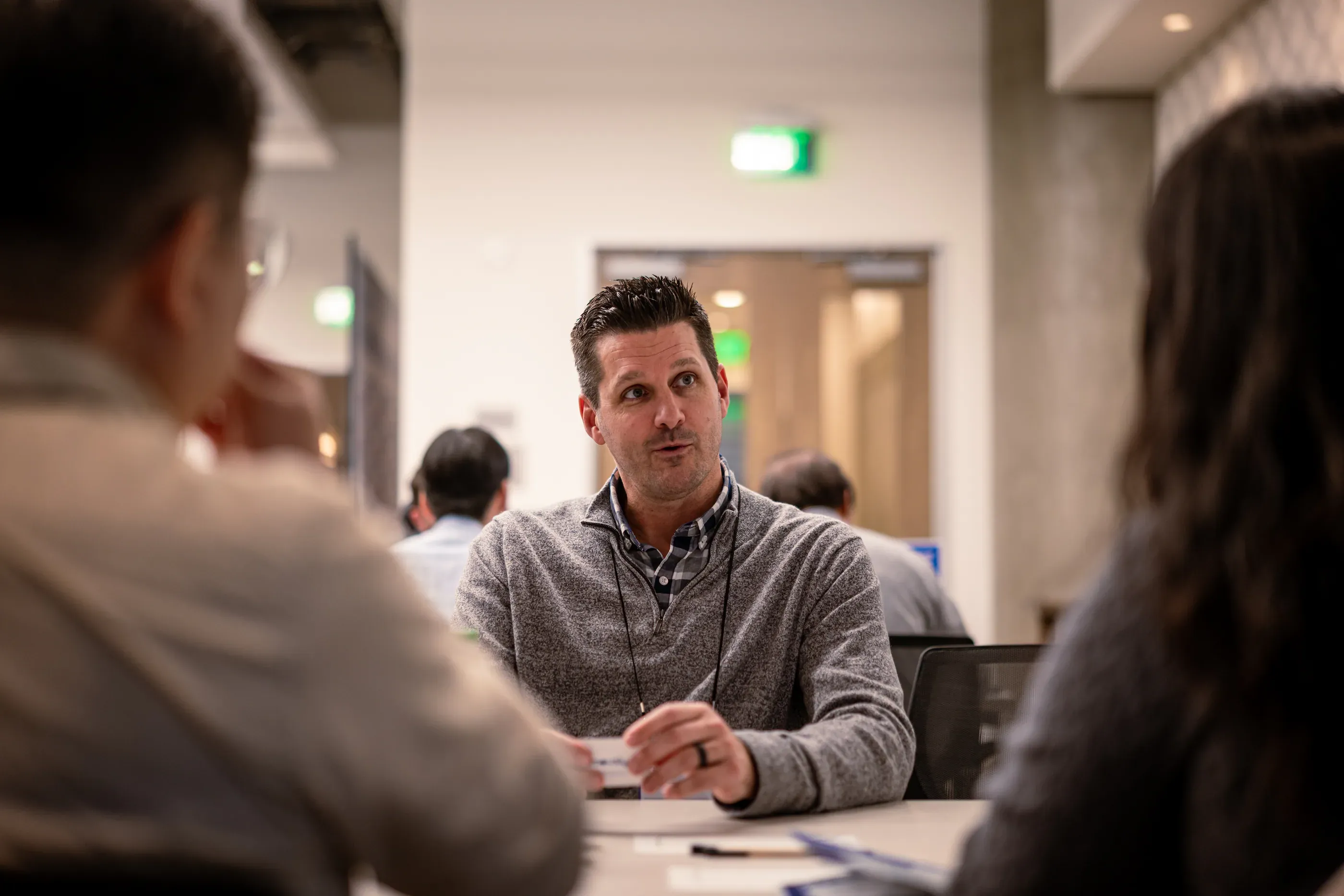 Speaker addresses a group during a startup meeting.