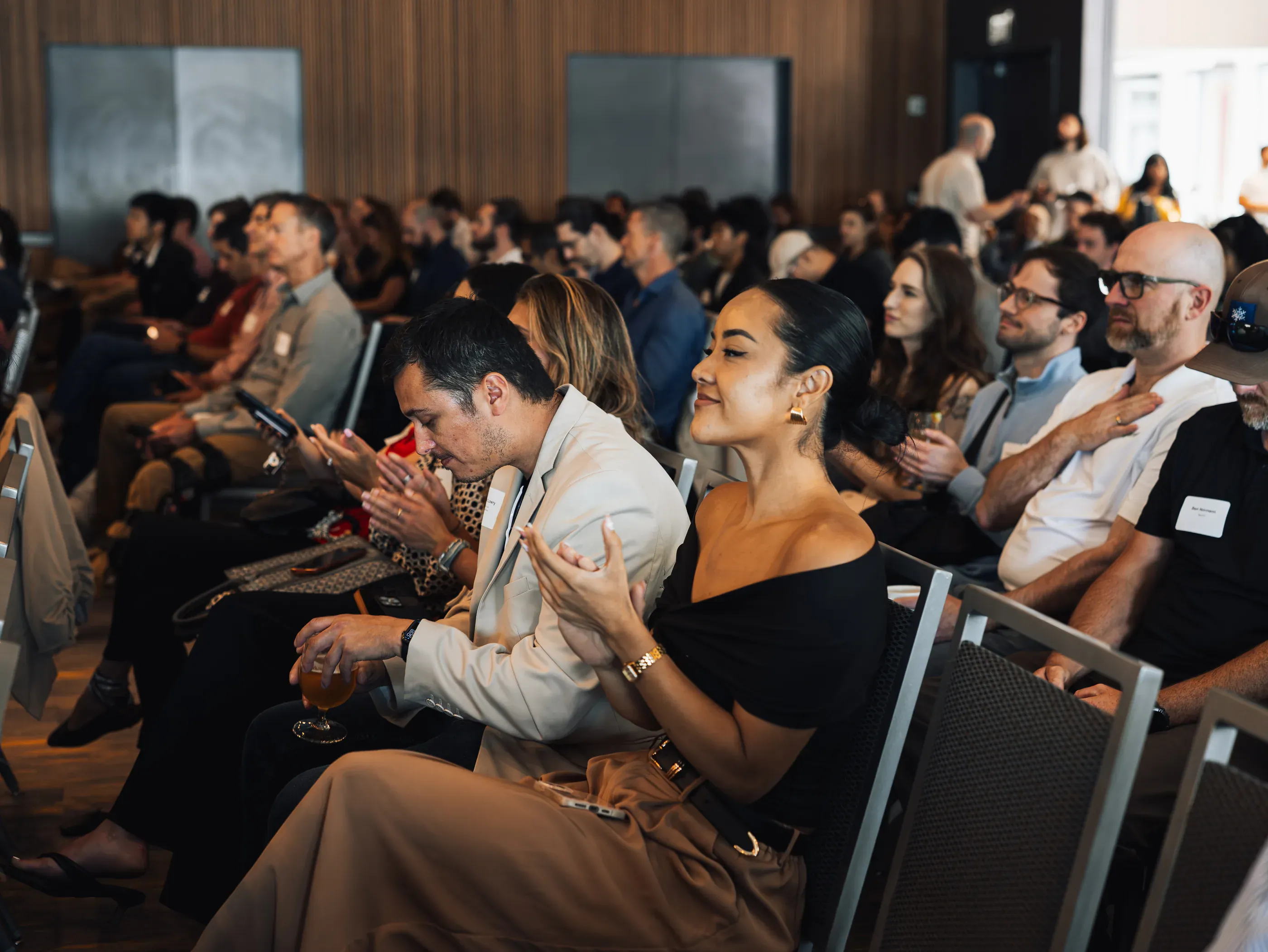 Audience applauding during a presentation at a Seattle tech event.