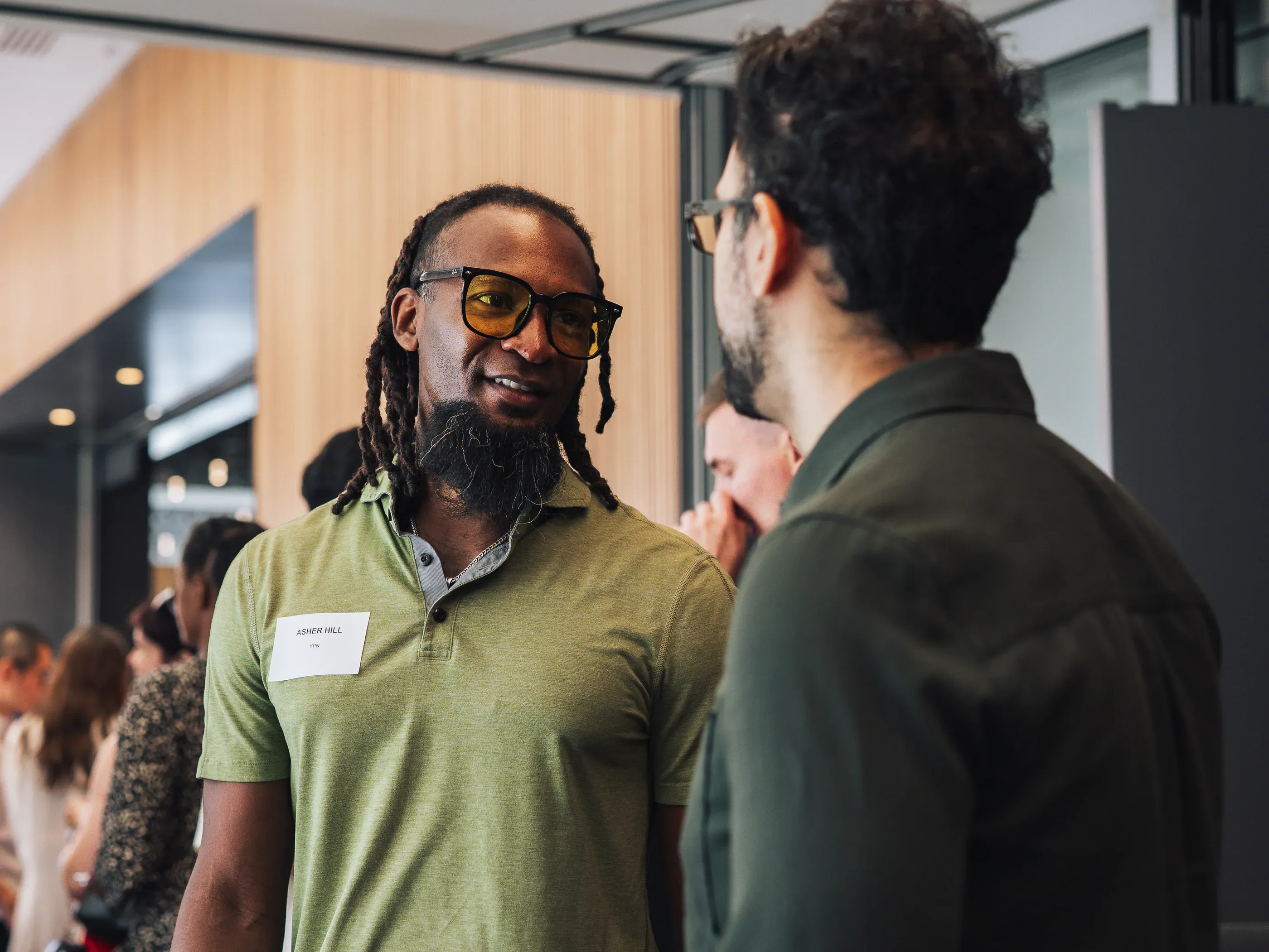 Two guests in conversation during a networking session.