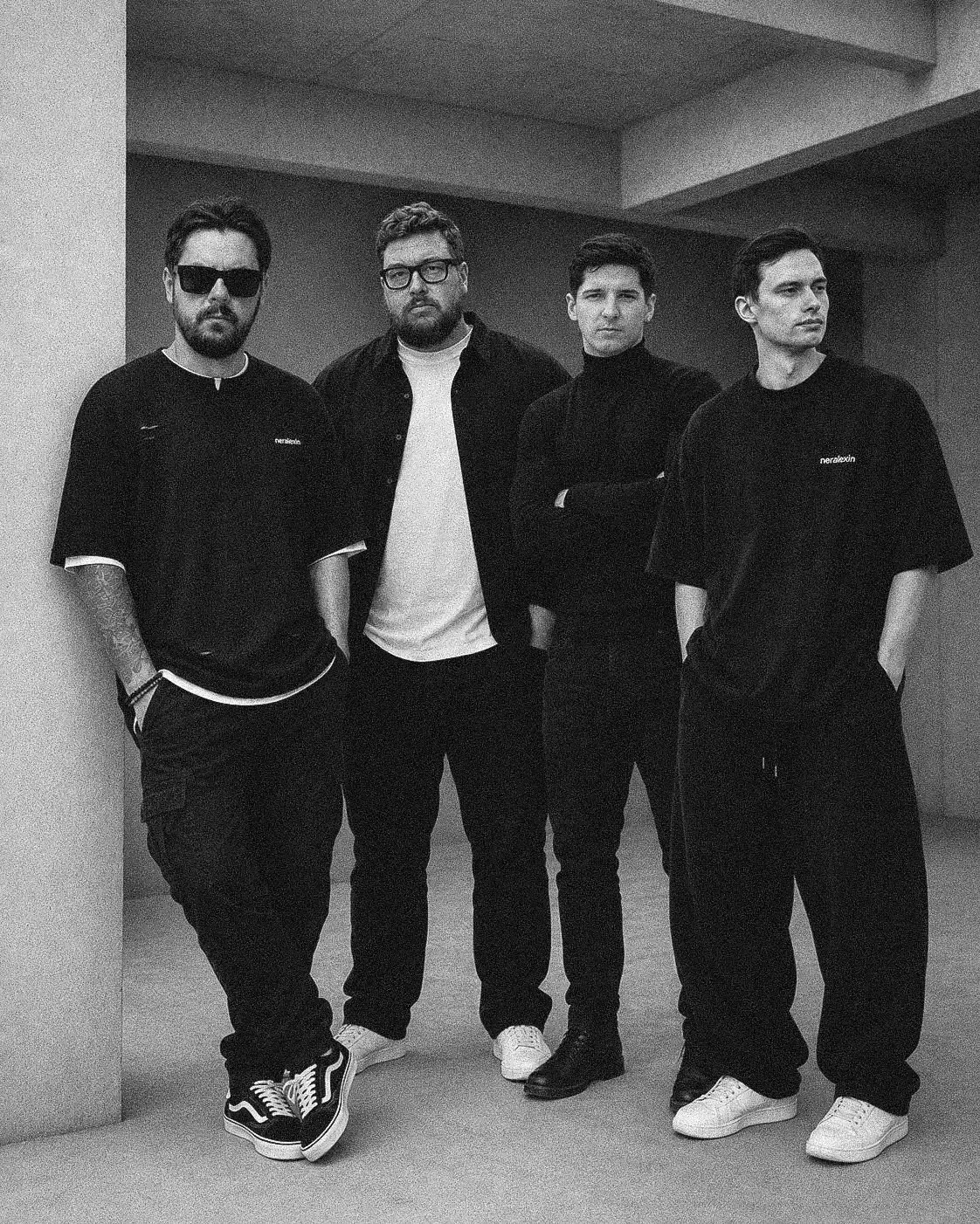 Black-and-white photo of the Neralexin team standing together in a concrete interior.